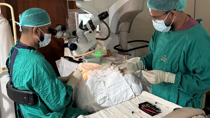 A surgical team performing cataract surgery